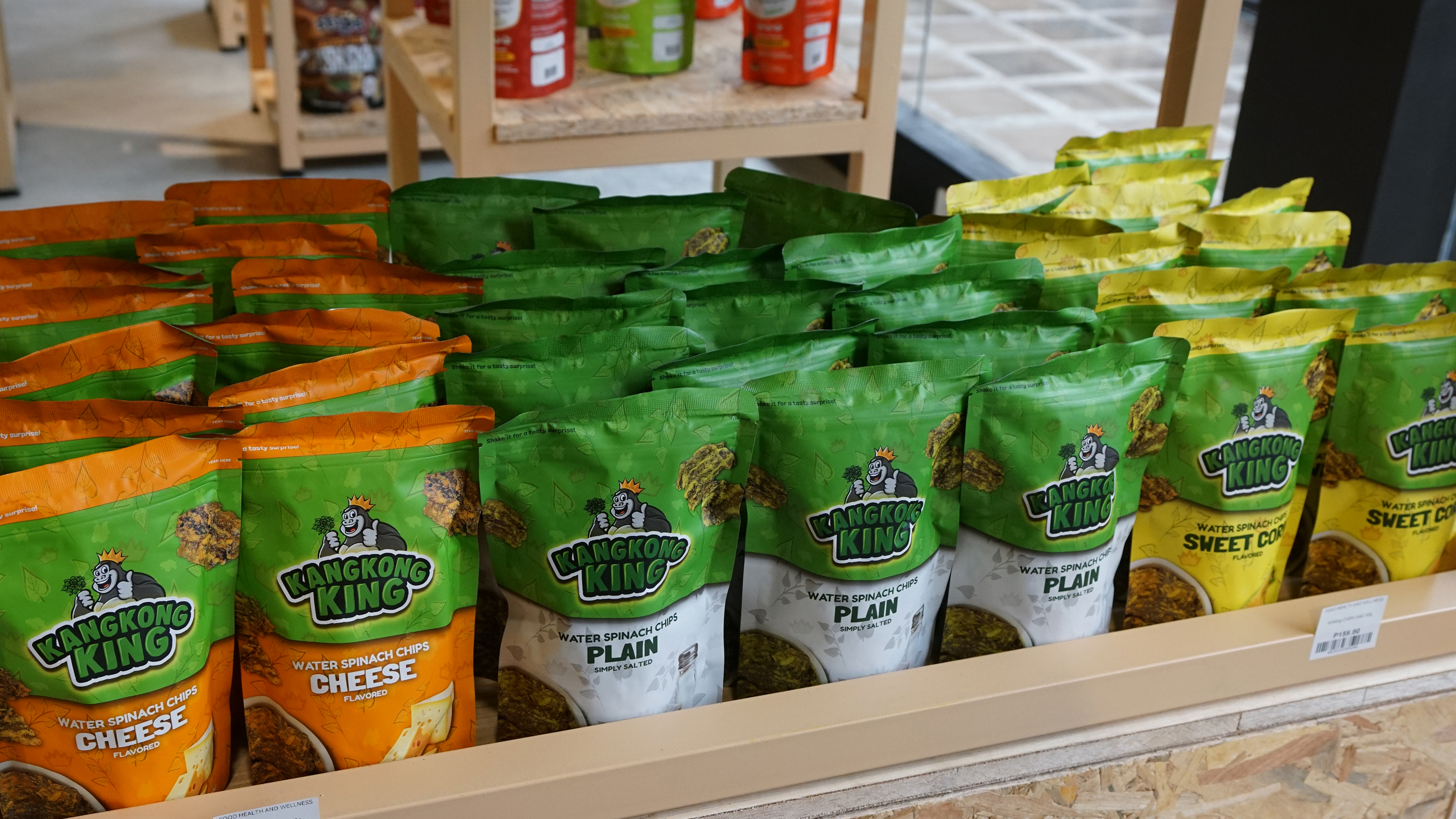 Rows of Kangkong King water spinach chips in cheese and plain flavors.